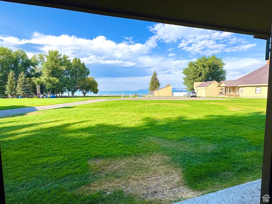 If you are looking for mind blowing, panoramic views of Bear Lake right outside your vacation condo, this unit will make a perfect fit. No stairs from the back slider, opens up right unto the beautiful ideal beach green space. Close to the pool, beach and all amenities including parking! Updated Kitchen & Bathroom and whole unit in excellent shape. Furniture included and ready to rent out or use!!!