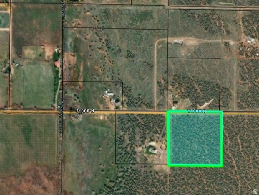 Stunning 9.95-acre flat parcel with breathtaking mountain views and plenty of space to build your dream home. Power is nearby for easy connection. The property will require residential rezoning, and the buyer will need to install a well and septic system as culinary and sewer are not available. Approximate Address:1400 W 11000 N