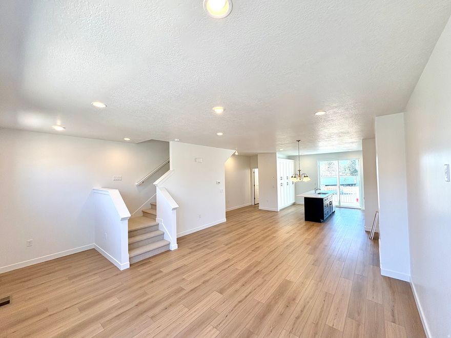 Gorgeous designer finishes and upgrades throughout this open, modern floor plan! Brand-new construction- fully completed and move-in ready. Multiple floor plans available! This popular layout offers 3 bedrooms, 3.5 bathrooms, and the rare benefit of three potential primary suites, each with its own private en-suite (two upstairs and one on the main level). The flexible main level suite can function as a bedroom/bath combo or an ideal home office, gym, or guest space.  Located in a prime Layton location, you'll enjoy quick access to Hill Air Force Base, I-15, shopping, dining, Lagoon, and miles of scenic trails. A community park is just steps away, and you're perfectly positioned right off Main Street- walk to nearby restaurants, with Layton Hills Mall less than a mile away.  Incredible buyer incentives! Seller is offering a 2/1 buydown with rates starting in the 34% range (call for details), and this home also qualifies for the $20K Utah Housing Grant! Additional units are available, but they're selling quickly-don't miss this opportunity.