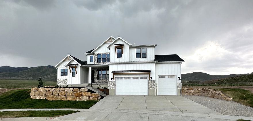 Under construction in Salem's Davis Farms community! This Arrow Ridge Homes Uinta plan sits on a .32-acre lot directly across from Salem Jr. High with fantastic mountain views. Home is fully framed with plumbing roughed in and estimated to be completed in approximately 3 to 4 months. Buyers who act quickly may still be able to select certain finishes and make parts of the home their own.  This 4,639 sq ft 2-story home features 5 bedrooms, 3.5 bathrooms, a main-floor master suite, 3-car garage, and a basement entrance. Interior highlights include 9-foot ceilings on the main floor and basement, open-concept great room, fireplace, open-to-below design, LVP flooring, gourmet kitchen package, ceiling-height cabinets, walk-in pantry, and a spacious master suite with separate tub/shower, double vanity, and walk-in closet.  Photos are of a previously built Uinta plan and are for example only. Final finishes, colors, features, and selections may vary. Buyer to verify all information.