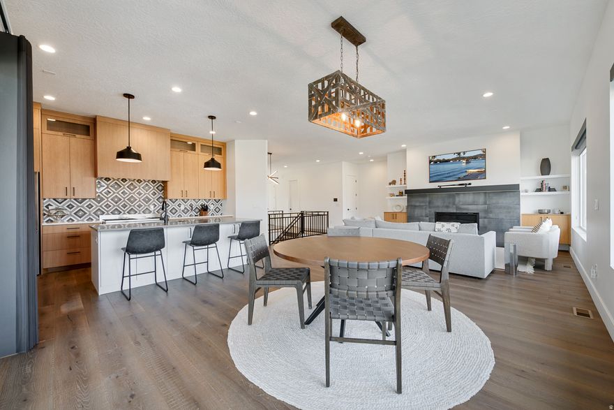 Nestled in Draper's coveted Sixth Street Cottages community, this beautifully crafted home blends modern luxury with effortless, lowmaintenance living. Thoughtful design choices elevate every space - from the lightfilled great room to the refined kitchen featuring premium finishes and a clean, contemporary aesthetic. The floor plan lives comfortably and intuitively, offering both openness for gathering and quiet corners for retreat. Residents enjoy a boutique neighborhood setting with quick access to Draper's best amenities, including parks, trails, dining, and commuter routes. Impeccably maintained and movein ready, this home is an exceptional opportunity for buyers seeking style, convenience, and a truly turnkey lifestyle in one of Draper's most charming enclaves. Thoughtful enhancements-including over $100,000 in upgrades-elevate every space, from the expanded Entertainer's lowerlevel lounge with kitchenette to the designer feature walls that add texture and dimension in three of the four bedrooms. Ample ski, snowboard, and bike storage accommodates the true outdoor enthusiast, while premium windows enhance natural light and energy efficiency throughout. This home has it ALL!