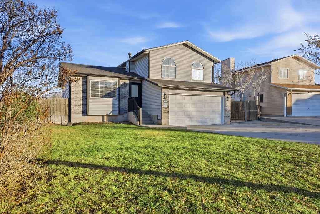 Photo of 5751 S DYNASTY OAKS CIR W, Taylorsville, UT 84118 (MLS # 2128553)