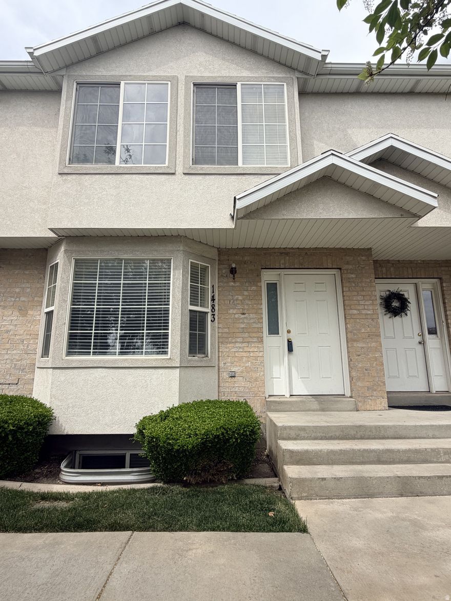 This charming home sits just steps away from Bicentennial Park, offering access to a pavilion, playground, fenced dog park, pond, and a scenic waterway with a boardwalk. Its prime location provides easy access to BYU, the freeway, nearby shopping, dining, and the mall.  Inside, recent updates-including fresh paint, new carpet upstairs, updated light fixtures and ceiling fans, and new hardware-make the home move-in ready. Guests will appreciate the nearby visitor parking and the beautifully maintained open green space cared for by the HOA.  The property also includes two reserved covered parking spots located directly behind the home, along with a private gate that leads to a sliding glass door opening into the dining area.   Square footage figures are provided as a courtesy estimate.  Buyer is advised to obtain an independent measurement.