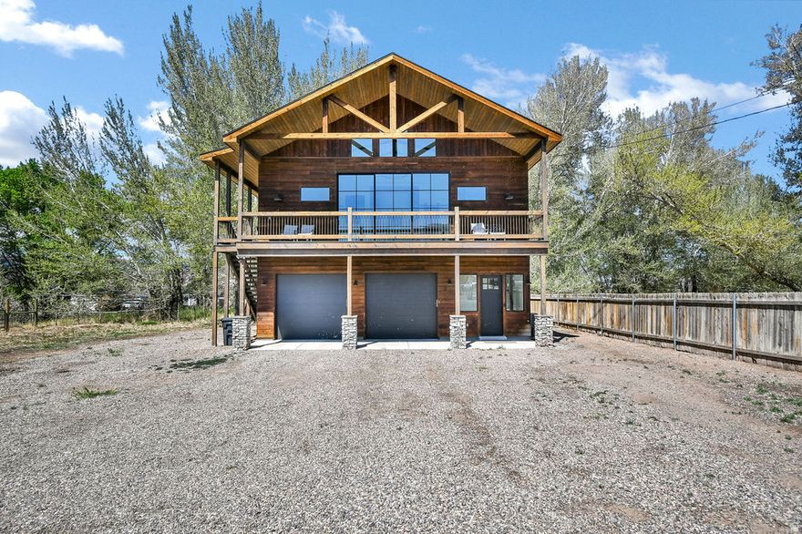 Tucked away at the end of the street in the peaceful setting of Annabella, UT this stunning 2 bedroom, 2 bathroom retreat offers the perfect blend of luxury, privacy, and strong investment potential. Situated on 1.37 acres with valuable irrigation water and livestock rights, this property is ideal for those looking to generate income now while building their long-term vision. Step inside the 1,771Sq. Ft home and experience an open-concept design filled with high-end finishes and natural light. The kitchen features beautiful granite countertops, while the living room is anchored by a striking gas log fireplace with floor-to-ceiling stone creating a true statement piece and warm, inviting atmosphere. The primary bedroom offers its own cozy electric fireplace, adding an extra layer of comfort and luxury. Every room is designed to maximize the setting, featuring oversized sliding glass doors that open to private balconies surrounded by quaking aspen trees, providing a peaceful, secluded feel. Enjoy three spacious decks, wired for a hot tub, and unwind in your private sauna for the ultimate relaxation experience. The property also includes an oversized garage and dedicated RV parking with power hookups. Currently operating as a successful nightly rental, this home is a proven income-producing asset with even greater upside. With ample acreage and layout potential, there is room to expand the existing structure making it an exceptional opportunity to create a larger estate or luxury retreat. Whether you're seeking a high-performing investment, a private getaway, or a property with room to grow into a custom estate, this one offers versatility, privacy, and long-term value. Located just minutes from scenic mountain trails, this property provides easy access to hiking, ATV riding, and endless outdoor adventure-making it just as appealing for personal enjoyment as it is for guests and renters.