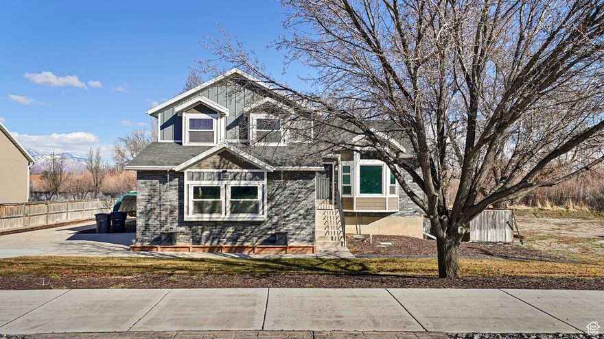 Welcome to this beautiful, move-in-ready South Jordan home. The home features many updates, including flooring, wainscoting, and paint. Make sure you notice the most amazing mountain views from the master bedroom. You will also enjoy the gathering spaces in the open-concept living and dining areas. The yard is well-maintained and would be ideal for entertaining, with ample parking, or simply enjoying your own quiet retreat. The garage is an oversized two-car garage, which could also be a workshop space.  You'll also find upgraded power, an air hose, a TV mount, wiring for two 50-amp car chargers, upgraded lighting, and separate heating. The property has two access points (curb cuts), one on the north and one on the south.  Square footage figures are provided as a courtesy estimate only and were obtained from county records.  Buyer is advised to obtain an independent measurement.