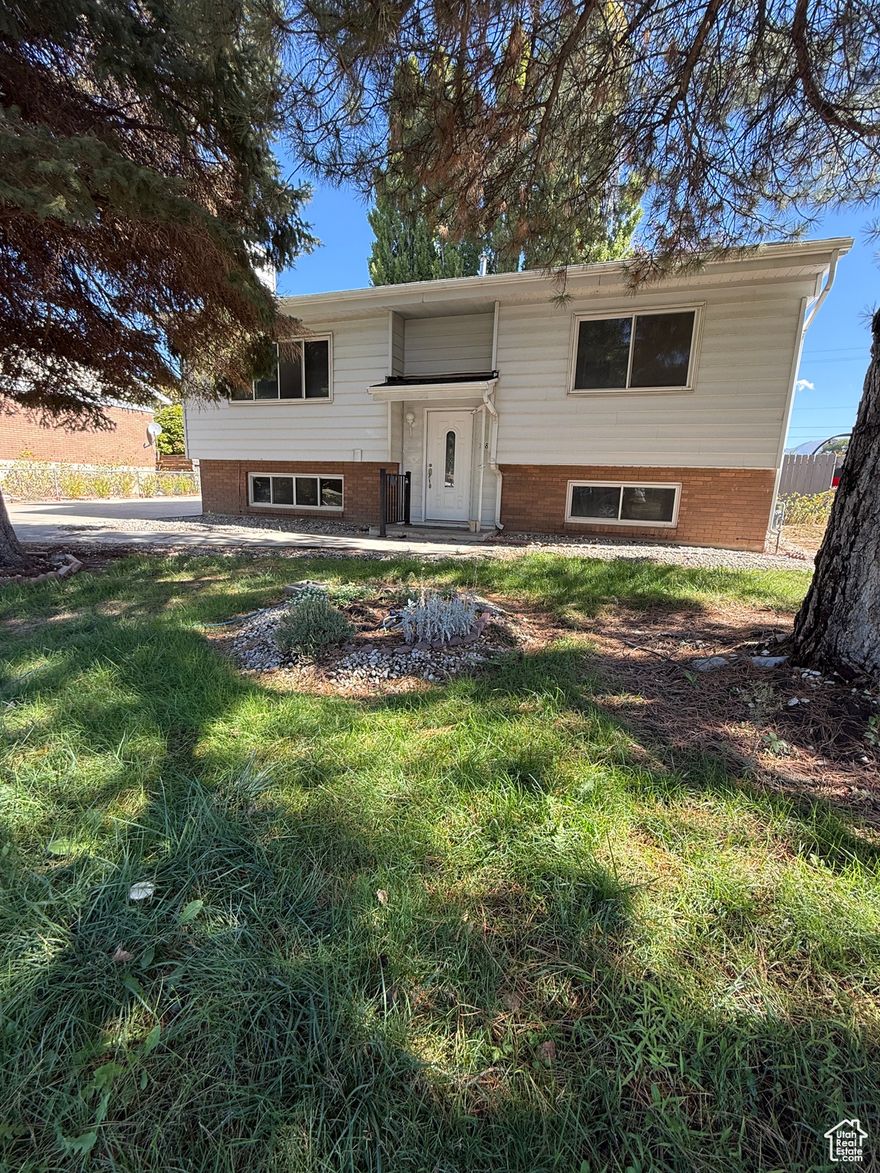 **SELLER IS OFFERING $8,000 IN CONCESSIONS.**  New Roof, New Flooring, New Paint THROUGHOUT! This beautifully renovated 4 bedroom 2 bathroom home has been completely updated with a new roof, new LVP, new carpet, and fresh paint throughout the entire home. This property includes a large fenced in yard  with no backyard neighbors. The backyard also features five mature trees along the back fence, offering added privacy and a serene backdrop. The basement has a separate entrance which could allow for potential mother in law unit. This home is located in a quiet neighborhood just minutes away from Hill Air Force Base, freeway access, parks and shopping.  Don't miss your opportunity to own this incredible home! Square footage figures are provided as a courtesy estimate only and were obtained from county records . Buyer is advised to obtain an independent measurement.