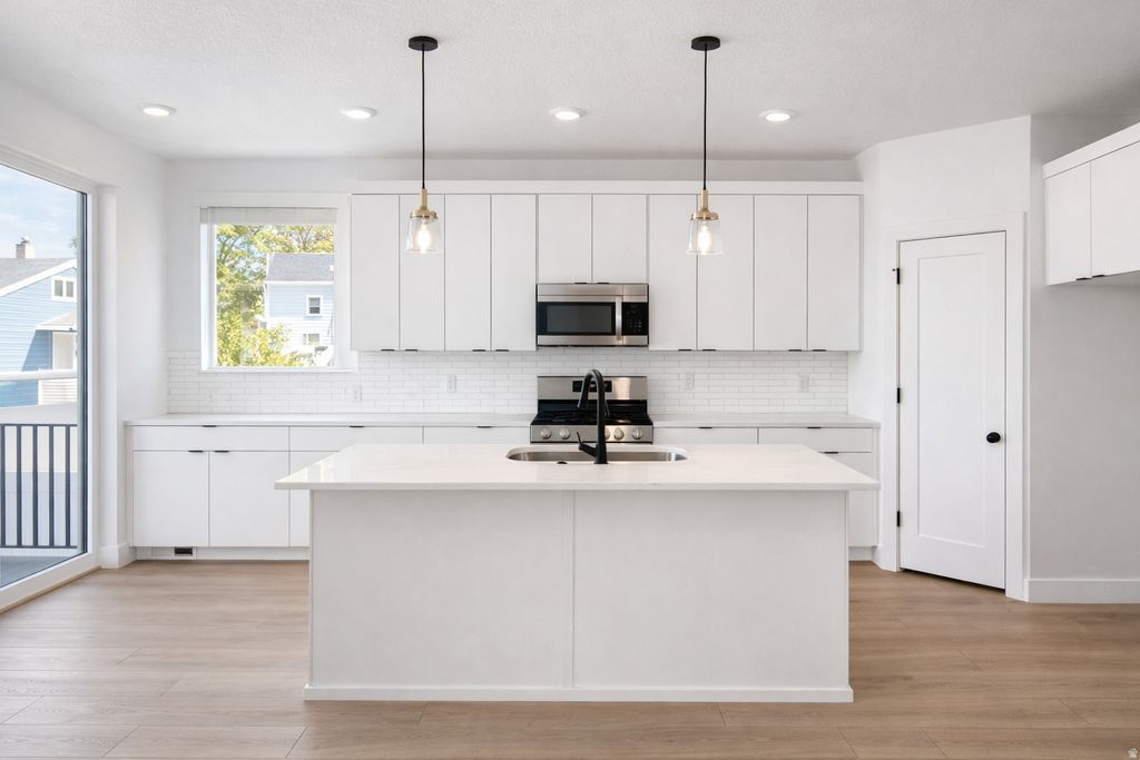 Photo of 6719 S VAUGHN LN #10, Midvale, UT 84047 (MLS # 2128187)