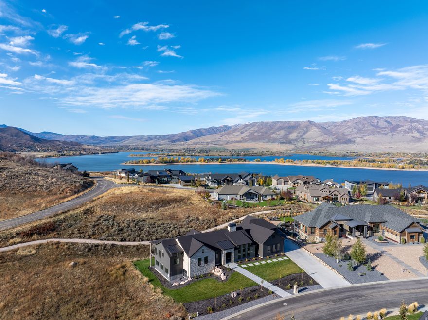 Welcome to this exceptional home combining modern design with timeless comfort. Perfectly situated on nearly half an acre, this 5,335 sq. ft. residence offers luxury living with panoramic hillside views and thoughtful craftsmanship throughout. Step inside to discover an open-concept floor plan featuring vaulted ceilings and an abundance of natural light. The centerpiece of the great room is a striking double-sided stone fireplace, creating warmth and ambiance for both the living area and the kitchen. The chef's kitchen is a true showpiece, boasting a large marble island, premium stainless-steel appliances, custom cabinetry, and elegant pendant lighting. Expansive windows frame the serene natural surroundings, while the adjoining dining area opens seamlessly to a covered patio - ideal for year-round entertaining. The spacious primary suite provides a peaceful retreat with spa-inspired amenities and ample closet space. Seven additional bedrooms offer incredible flexibility for family, guests, home offices, or a fitness studio. Enjoy the perfect blend of indoor-outdoor living with a covered deck overlooking the landscaped yard, surrounded by scenic rolling hills. A 5-car garage, ample storage, and refined finishes throughout complete this remarkable property. Located in a desirable neighborhood, this home offers privacy, elegance, and the perfect setting for modern living. All property information, boundaries and documents to be verified by buyer.