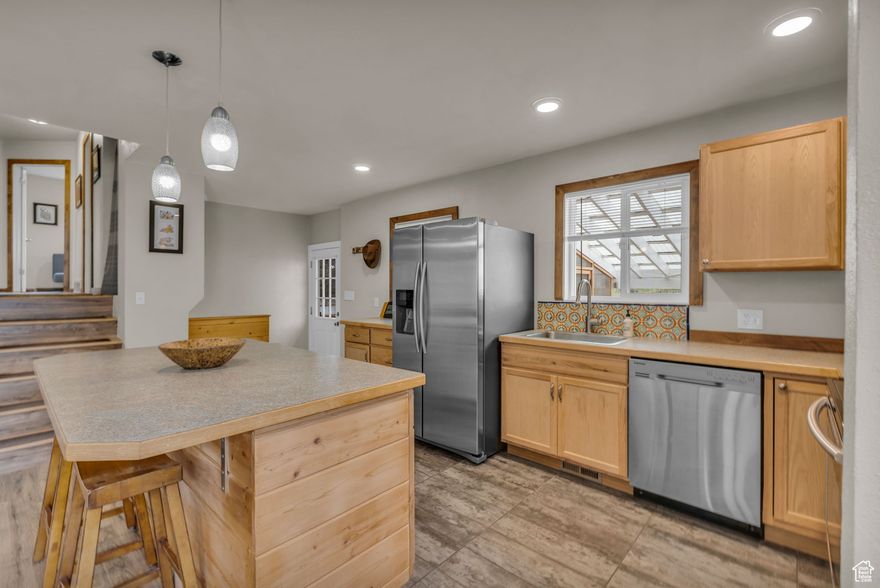 Welcome to your light, bright Kamas home close to town, while having quick access to recreation in the Uinta Mountains. The open main-level floor plan makes entertaining effortless, while the primary suite offers a walk-in closet and a private bath. The lower level functions as its own space, perfect as a guest suite or work-from-home office. Step outside to your enclosed patio or newer mahogany deck off the back of the home to enjoy fresh mountain air and scenic surroundings. Complete with solar panels, this home blends sustainability, space, and style. Opportunities like this are rare in Kamas Valley, one visit will have you wanting to make it your own. Square footage figures are provided as a courtesy estimate only and were obtained from county records.  Buyer is advised to obtain an independent measurement. It is also recommended buyer confirm lot size.