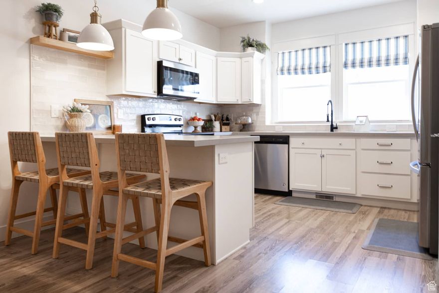 Completely upgraded town home in Lehi. This home shows like a model home and has been well taken care of by current owners. Conveniently located minutes from schools, parks, shopping, and access to I-15 and mountain view corridor. Complete with large open concept, upgraded flooring, quartz countertops, backsplash, upgraded fixtures and finishes in kitchen, bathrooms, and main living spaces. Beautiful open master suite, and much more. Easy to show.