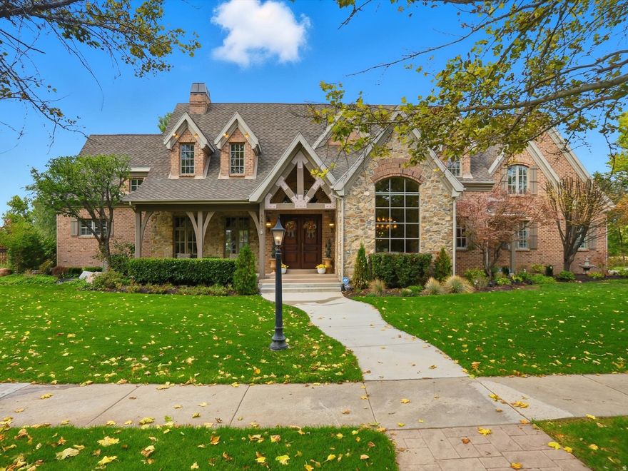 Nestled on one of Draper's most enchanting tree-lined canopy streets, this extraordinary estate sits on a private 0.61-acre lot-the crown jewel of the neighborhood. The hand-crafted brick and real stone exterior, solid Brazilian cherry wood flooring, Marvin wood-clad windows, and exquisite architectural details exemplify timeless, curated craftsmanship. The open-concept design features a two-story great room with a 30-foot real stone fireplace and wood-beamed ceiling. The gourmet kitchen offers informal dining, granite countertops, a new Thermador range, hood, and oven, plus a walk-through butler's pantry leading to a formal dining room. A spacious theater room on the lower level adjoins a kitchen, ideal for entertaining. The home offers unmatched flexibility with seven bedrooms, including four en-suite baths, two main-floor powder baths, three family rooms, a large craft/wrapping room, three storage rooms, and a private multi-desk office with built-ins. The main-level primary suite features an en-suite bath, a large walk-in closet with built-ins, and an island with locking jewelry drawers. French doors open to private, shaded outdoor dining and a serene backyard with a spa-like retreat. Additional features include solid wood four-inch shutters, three fireplaces, three air conditioners, and four furnaces that maintain consistent temperatures, an ADT security system, and nine-foot basement ceilings. The heated four-car garage includes two EV outlet plugs. Six French doors open to the backyard, allowing you to enjoy seamless indoor-outdoor living. Main-floor and lower-level laundry rooms offer added convenience. The backyard provides privacy with an eleven-foot-deep saltwater pool, a peaceful babbling stream, and shaded dining under a pergola with views of a five-acre ranch filled with horses and wildlife. Two water shares offer secondary water to complete this exceptional property. This estate offers a lifestyle of elegance, comfort, and natural beauty in one of Draper's most coveted neighborhoods.. Square footage figures are provided as a courtesy estimate only and were obtained from County Records.  Buyer is advised to obtain an independent measurement.