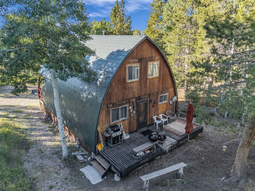 Tucked away in the heart of the stunning Uinta Mountains, this secluded cabin offers the perfect escape from the hustle and bustle of everyday life. Surrounded by towering aspens and whispering pines in the highly sought-after Uintalands Subdivision, this cozy mountain retreat features 2 bedrooms, a charming sleeping loft, and 1 full bathroom-perfect for family getaways, romantic weekends, or unforgettable adventures with friends. Set on 3.43 acres of peaceful, private land, there's plenty of room to stretch out, explore, and even invite others to camp under the stars on your own slice of mountain paradise. Picture yourself sipping coffee on the porch while deer and moose wander through the trees, or heading out on a snowmobile or RZR ride straight from your cabin into thousands of acres of pristine wilderness. Whether it's a peaceful morning hike or an adrenaline-filled afternoon exploring the backcountry, this property puts you right in the heart of it all. An F-150 with snow tracks is also available for separate purchase, making winter access a breeze via the groomed roads, while the main road is plowed year-round to the community parking lot. Whether you're seeking solitude or looking to host unforgettable mountain adventures, this one-of-a-kind retreat has it all.