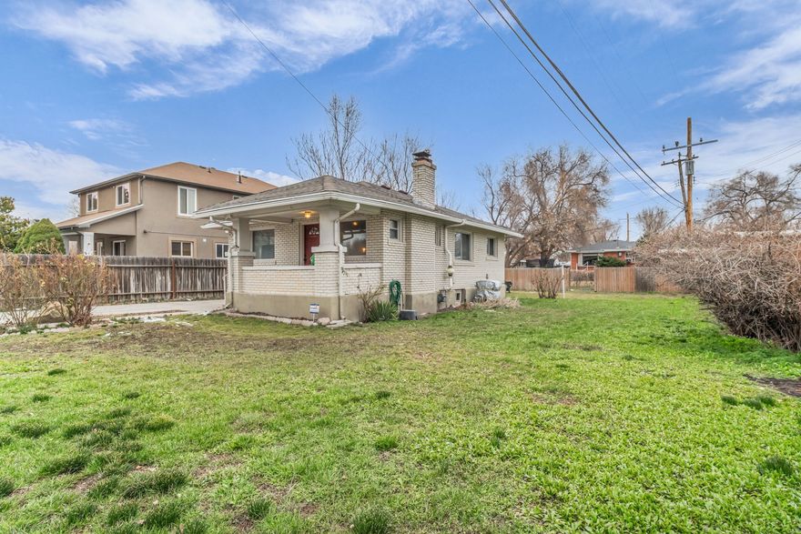 Charming brick home situated in very close proximity to downtown.  Large .20 acre fenced yard with lots of possibilities.  Iconic bungalow style front porch.   Walk across the street to Jordan River trail and International Peace Garden.  One car detached garage. **Please Note:  There is a huge garden BEHIND the back yard area. If you look through the last photos you can see behind the wooden fence there is a separate garden area.