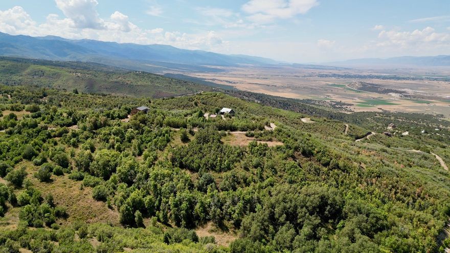 Ready to build? This 1.82-acre lot in Legacy Mountain comes with a cabin pad already cut in, saving you time and money. With good usable space and a gentle slope, it's the perfect launchpad for your dream mountain getaway. Located in a gated community just outside Fairview, this property offers the best of mountain living-quiet privacy, year-round recreation, and sweeping views of the surrounding peaks and valleys. Power and water are available at the road, making the build process smooth and straightforward. Whether you're relaxing under the aspens, watching wildlife pass through your trees, or heading out for a weekend of snowmobiling, hiking, or 4-wheeling, Lot 4 offers a rare blend of convenience, beauty, and adventure. This is more than a lot-it's your place to connect with nature and create something lasting.