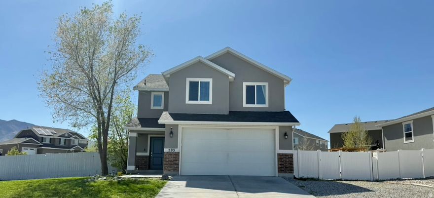 Welcome to this beautiful 2-story home nestled in a highly desired Stansbury Park subdivision. Built in 2014, this fantastic property features 3 bedrooms and a perfectly designed, bright floor plan. Enjoy stunning mountain views from your spacious, fully landscaped corner lot, complete with an automatic sprinkler system and partial fencing for your privacy.The home also boasts an attached 2-car garage with highly sought-after RV parking, giving you plenty of space for all your toys and vehicles. Inside, you'll find comfortable living spaces with central air, along with an included built-in dishwasher and microwave for everyday convenience. This wonderful home offers the perfect blend of comfort and outdoor living. Square footage figures are provided as a courtesy estimate only. Buyer is advised to obtain an independent measurement.