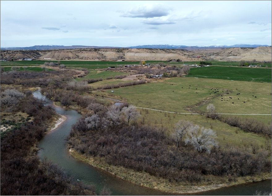 47 riverfront acres located less than two miles west of Duchesne, UT.  850 feet of prime brown trout fishing on the Duchesne River. Zoned A-5 (Agriculture - 5-acre minimum lot size). Rocky Point Ditch Company water shares: 27 A shares, 6 B shares. Irrigated land shares pivot with neighboring property to the North. Farm/cattle tenant pays $250/month. Duchesne County parcel 00-0008-1244, 2023 Taxes: $109.33. Access along Duchesne County roadway 8500 South. 65 miles from Park City, Utah. 90 miles from Salt Lake City, Utah.