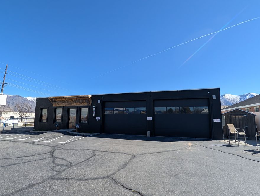 Exclusive main street frontage in rapidly growing Spanish Fork.  Surrounded by very successful retail.  Former use was a car lot, large enough for 40-45 trucks.  Building has been remodeled and in great condition.  2 bay shop / garage.  Many potential uses.  Main street signage.  Rare opportunity.