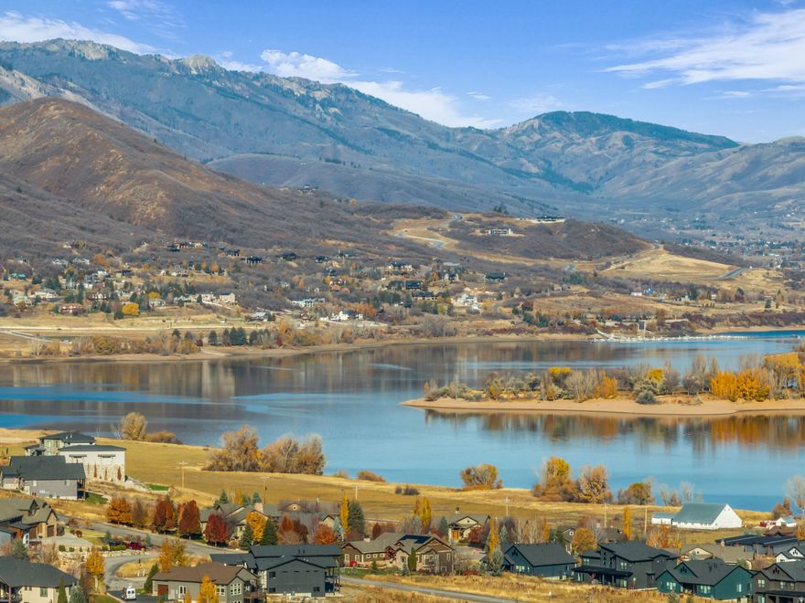 Perched on a quiet hillside with sweeping views, this vacant lot overlooks Pineview Reservoir for summer boating, paddling, and beach days. Winter is just as good, with Powder Mountain and Snowbasin minutes away for world-class skiing and riding. The location makes daily life simple, too. Park City day trips are easy. Downtown Ogden is close. Salt Lake City and the SLC International Airport are about 40 minutes away. Great access, stunning vistas, and four-season recreation at your doorstep. Value priced among current area listings, this is a rare chance to build a design-forward mountain home in a setting that feels private yet connected. A dreamy homesite with the hard stuff already solved. Bring your architect and imagine the views from every room.