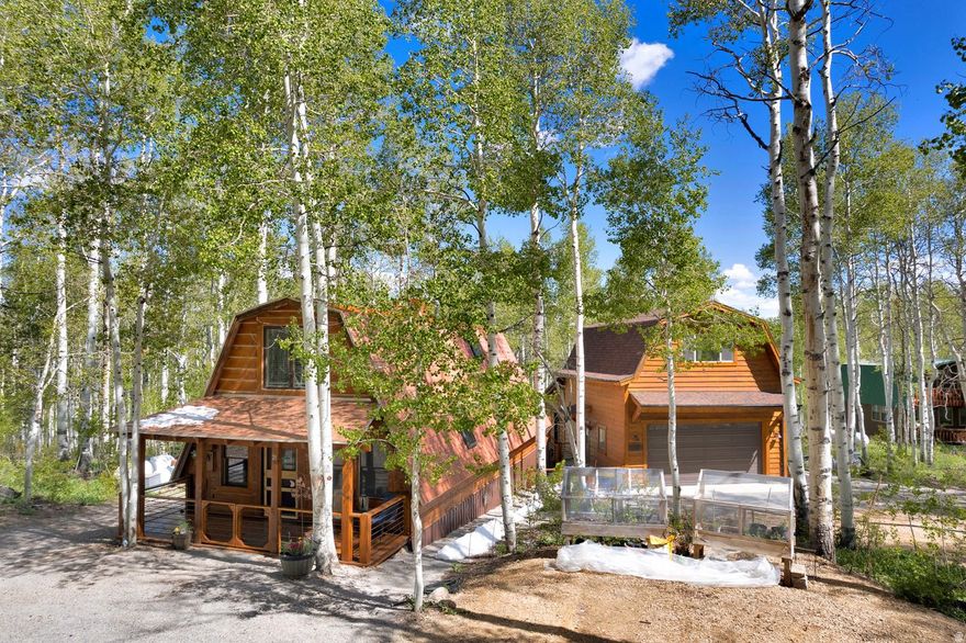 Located in the gated Timber Lakes community near Heber City, this updated cabin-style home is designed for practical year-round mountain living with convenient seasonal functionality. Set on 1.01 wooded acres, the property includes a detached oversized 2-car garage with upper-level flex/storage space plus an additional workshop area at the rear of the garage ideal for tools, outdoor equipment, hobby space, or recreation gear storage. The home features forced air heat, a chef's kitchen with high-end appliances, covered decks, mature trees, mountain views, wired ethernet, and a wood-burning heat source. Interior utility routing through the center of the home supports winter usability, along with an accessible drain and shutoff setup for simplified seasonal management. Conveniently located near trails, Heber Valley, Deer Creek Reservoir, Jordanelle, and Deer Valley East Village. Nearby Amenity List Timber Lakes gated entrance ( 1 mi), Heber City, Main Street shopping & dining ( 12 mi), Deer Creek Reservoir ( 10 mi), Jordanelle State Park ( 15 mi), Deer Valley East Village / Mayflower base area ( 19 mi), Park City Main Street ( 23 mi), Wasatch Mountain State Park ( 14 mi)   Square footage figures are provided as a courtesy estimate only and were obtained from independent measurement.