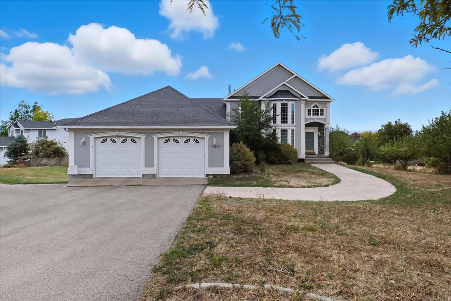 Beautiful home featuring large windows, vaulted and cathedral ceilings, and three fireplaces. The updated kitchen includes granite countertops and backsplash. A built-in office, loft, and solarium/atrium add great versatility. The basement offers full-size windows and built-in blinds in French doors for plenty of light. The primary suite includes a jetted soaking tub, separate shower, and bay windows. Circular driveway, mature trees, and a great yard for play or entertaining.