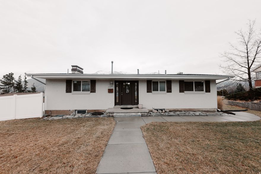 Home with a beautiful BSMT/MIL Apt? Beautifully remodeled South Ogden rambler sitting on a rare .38 acre corner lot with incredible mountain views, a massive deck, and a flexible basement apartment setup! This home was extensively updated around 2018 and the quality of the remodel truly stands out from the moment you walk in. The main level features an open layout with a stunning kitchen, custom cabinetry, granite countertops, updated flooring, modern finishes, and large windows bringing in natural light and mountain views.  The oversized covered/uncovered composite deck is one of the best features of the home and offers an incredible space for relaxing, entertaining, BBQs, or simply enjoying the Wasatch Front views. The property also includes an extra-length 1 car garage and a large driveway with parking for 6+ vehicles with ease.  The basement features a separate entrance, full kitchen, laundry, bedroom, bathroom, and living space creating excellent flexibility for rental income, multigenerational living, guests, or simply extra space to enjoy. Rental income has been a huge benefit, but the home also functions perfectly as a single-family residence if preferred.  Located in a quiet established neighborhood with quick access to Hwy 89 for an easier commute without constantly fighting I-15 traffic. Roof, HVAC, and major systems have all been updated within recent years. Truly a rare opportunity to own a move-in ready home with views, space, parking, and income potential in one of South Ogden's most desirable areas. Agent Owned.  Square footage figures are provided as a courtesy estimate only .  Buyer is advised to obtain an independent measurement. Buyer & buyer broker to verify all info.