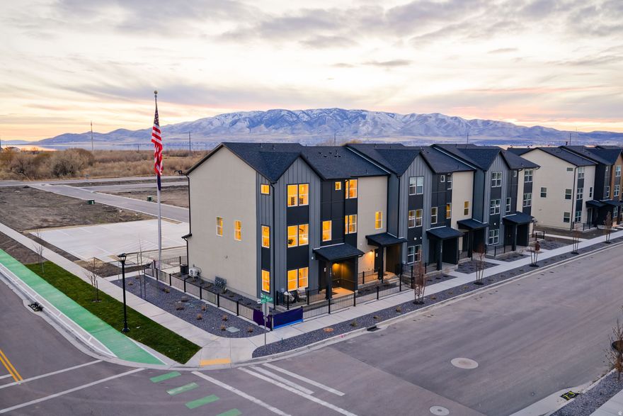 The three-story Manhattan townhome plan in Highline at American Fork offers ample living space and inviting design with up to 2,163 square feet. Perfectly positioned facing the park with beautiful views The first floor offers a versatile flex room, waiting to be transformed to meet your needs. An open great room is at the heart of the second floor, flowing seamlessly into a dining area and a kitchen with a center island and a walk-in pantry. You'll also find a powder bath conveniently located on this level. The primary suite is on the third floor, boasting a walk-in closet and a private bath. Two additional bedrooms, each with a walk-in closet, round out this popular plan.Prime American Fork location just minutes to I 15, Highway 89, and the American Fork FrontRunner Station for easy commuting north or south. Close to shopping, dining, entertainment, and nearby trails. Central, convenient, and close to it all