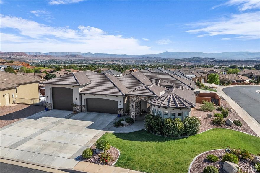 Custom home with fantastic valley views and thoughtfully designed floor plan. A detached 1 bedroom casita with kitchenette, bed, bath and stackable laundry hookups, perfect for guest or extended living. The main living area offers an open concept design with a modern kitchen featuring white cabinetry, sleek black stainless appliances and an oversized island that flows seamlessly into the spacious living room. Large windows frame the views and fill the space with natural light. The walkout basement extends the living space with a family room, kitchenette and a second primary suite that includes ensuite bath. Enjoy two additional guest bedrooms each offering their own private bath. The oversized RV garage is 17.2' wide by 35.8' deep, has a 14' x 14' door and epoxy floors. Nestled in a serene neighborhood, minutes from parks, shopping, restaurants, the mall, and more, this property is ready for you to call home.