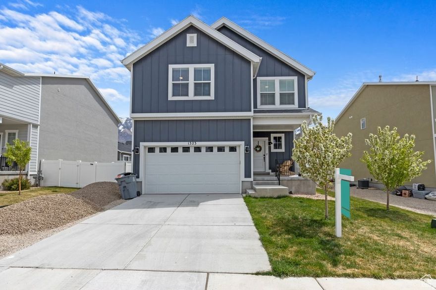 Nestled in the scenic community of Santaquin, this well-maintained 5-bedroom, 3.5-bath home offers a thoughtful blend of modern design and everyday functionality. Built in 2022, this floor plan features an open-concept layout with abundant natural light, creating a comfortable and inviting living space.  The kitchen includes quartz countertops, gray shaker-style cabinetry, and under-cabinet lighting, providing both style and practicality. The primary suite includes a private bathroom, and additional bedrooms offer flexible space for a variety of needs.  Interior features also include accent lighting in the primary bedroom and functional upgrades throughout the home. The exterior offers a well-kept yard with space that can be used for outdoor enjoyment, along with installed eave outlets for seasonal lighting.  Located with convenient access to local amenities, schools, and outdoor recreation, this home also offers views of the surrounding mountains and the charm of a growing community.  Buyer to verify all information.