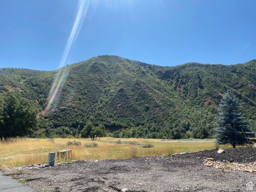 Stunning near 1 acre lot in a beautiful gated community. Build your dream home up the canyon in the clean air in this scenic location.  This is lot 18 in The Cottages (gated) community. Inquire about a bulk discount when purchasing all 3 lots, 18,19 & 20.