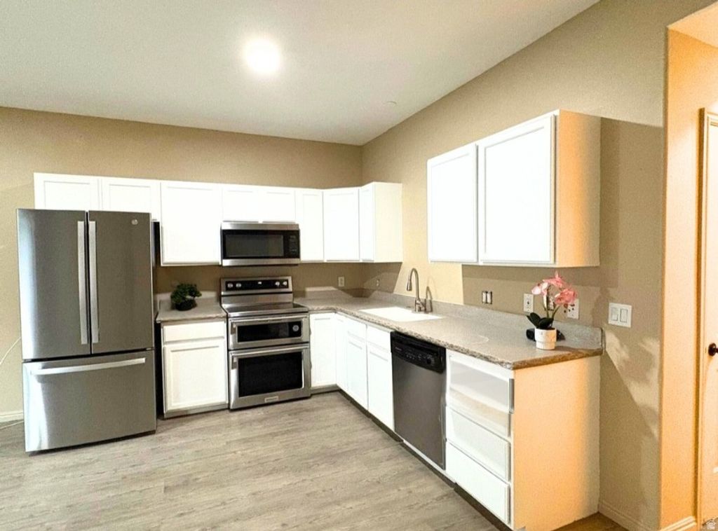 Photo of 2402 S BLACK VILLAGE CT W, West Valley City, UT 84119 (MLS # 2125241)