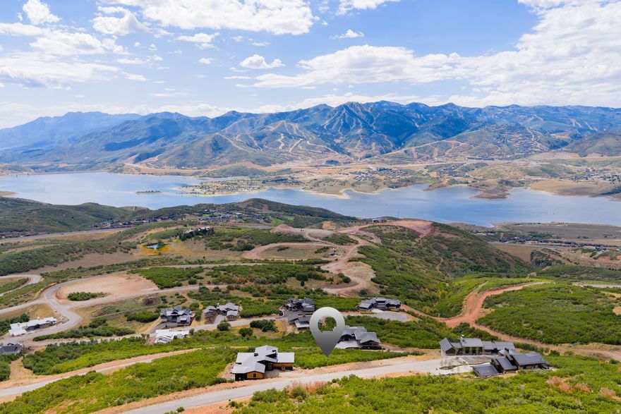 This is the signature view lot in Golden Eagle-arguably offering the most panoramic vantage point in all of Park City. From this coveted 0.58-acre downhill, easy-build homesite, your future residence will command sweeping, unobstructed vistas of Jordanelle Reservoir, the ski runs of Deer Valley, and the iconic Mount Timpanogos-a truly unmatched backdrop for your to build your dream retreat.  Golden Eagle spans more than 600 acres, with 25% preserved as open space. Residents enjoy miles of private trails and will soon gather at the planned clubhouse featuring  indoor/outdoor spaces, a kitchen, and a fire pit. A restrictive nightly-rental policy ensures a quiet, residential lifestyle with a true sense of community.  All of this is just 15 minutes to the new Deer Valley East Village, close to Park City's Historic Main Street, and only 35 minutes to Salt Lake International Airport. Rarely does a homesite combine such prestige, convenience, and world-class views-this is Golden Eagle at its absolute finest.