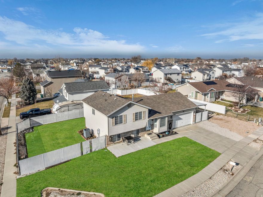 High-End Value & Massive Toy Storage! Beat the market with this move-in-ready gem. At an affordable price, this home features over $25k in premium mechanical upgrades you won't find at this price point.  Located close to I15 and Hill Air Force Base. THE UPGRADES: Enjoy total peace of mind with a new high-end Amana 2-stage HVAC system with AprilAire Steam Humidifier and REME Halo Air Purifier (2022), stainless steel appliances (2022), and a Rinnai Tankless Water Heater (2022). Even the 2-car garage is heated with a Coleman furnace (2023)! THE LIFESTYLE: The interior boasts updated bathrooms, fresh paint, and a custom feature wall with an electric fireplace and built-in surround sound/TV (INCLUDED). The basement offers a gym space easily convertible to a family room and is ready for a future 3rd bathroom. (ALL gym equipment is EXCLUDED) THE SPACE: Bring the fleet! Features a massive 19x65 ft RV pad, a covered carport, and a new cement patio in the front with a new awning in the back. High-end comfort meets unmatched utility-schedule your tour today!