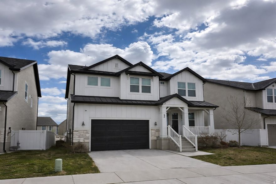 Clean, modern, and move-in ready-this 4-bed, 2.5-bath Saratoga Springs home offers an open-concept layout with a bright kitchen featuring white cabinetry, sleek counters, and a large island. Sun-filled living spaces with oversized windows, plus a versatile upstairs loft and spacious bedrooms. Primary suite includes a walk-in closet. Neutral finishes throughout. Attached 2-car garage. Near Utah Lake, Inlet Park, Jordan River Trail, and shopping at The Crossing.
