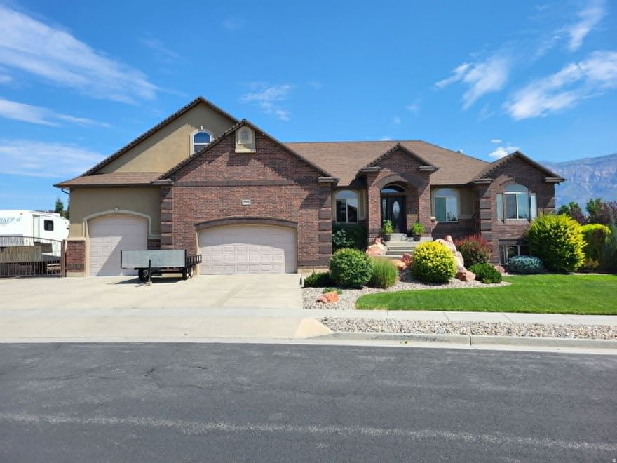 Parade of Homes Custom Built. Upgrades galore. Completely landscaped, fully fenced yard, 4 car  heated garage (3rd car goes through), Huge 40 x 40 detached shop to store all of your toys.  Covered deck, private patio, 2nd kitchen in walkout basement.  This home wants you to buy it and the sellers also want to make this happen. AMAZING Farr West home. Most everything in the home has been custom built. From the incredible kitchen to the crafted wood on the walls and floors. Home offers 4251 sq ft of spacious living, thoughtfully designed to provide a seamless flow perfect for entertaining. Located on a large .42 acre lot, this home combines modern upgrades with timeless charm.*** The updated kitchen features a gas range, custom Granite countertops, and ample storage-ideal for both cooking and hosting.    Seller would like to leave the pool table in basement for new owner.   Also available is the Canopy bed set in the Primary bedroom.  Step outside into the beautiful backyard patio area, where it is privately inviting and comfortable and also wired for a hot tub!  Conveniently located,  this home offers the perfect blend of comfort and style. Don't miss your chance to own this stunning home. Measurement were provided from county records. ATTENTION****   THE ADDRESS ON THE HOME IS DIFFERENT THAN THE ADDRESS ON COUNTY RECORDS.  USE THE COUNTY ADDRESS TO LOCATE THE HOME IN YOUR GOOGLE MAP.  (We are currently working with Title to correct this problem). 2614 W. 2450 N. FARR WEST, UT 84404