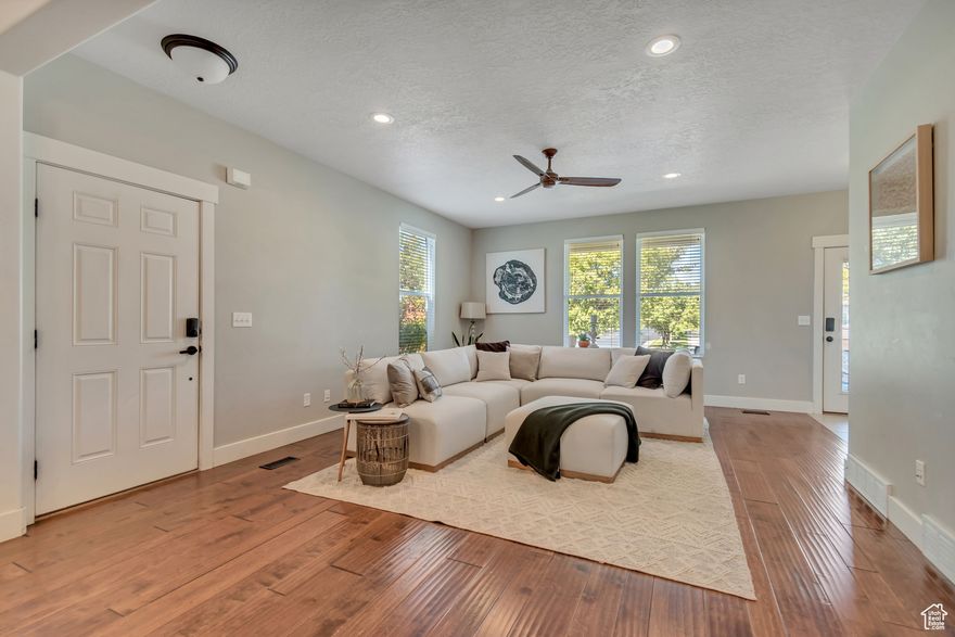 Daybreak Living at Its Best - Spacious Home, Ideal Location Imagine living in the heart of Daybreak, where top amenities are right outside your door. This desirable end lot home offers extra privacy and ample guest parking-a rare find in one of Utah's most walkable communities. Surrounded by parks in every direction, you'll enjoy choosing between swings, slides or scenic strolls any day of the week. On Saturday mornings, take a peaceful five-minute walk to Harmons for syrup and fresh produce, or unwind after a long day with a tranquil evening walk to Oquirrh Lake. Inside, the home features spacious bedrooms with large walk-in closets, providing comfort and convenience that's hard to come by. All with NEW carpet!  The open-concept kitchen is designed for both everyday living and entertaining-complete with double ovens. Step out to the covered patio, perfect for quiet mornings or casual gatherings with friends. Enjoy the efficiency of dual furnaces and A/C units, keeping the home comfortable in every season. Natural light fills the interior, creating a bright and welcoming atmosphere that complements the home's thoughtful layout. Whether you're hosting in the kitchen, relaxing in oversized bedrooms, this Daybreak home offers the perfect blend of space, style, and community living.