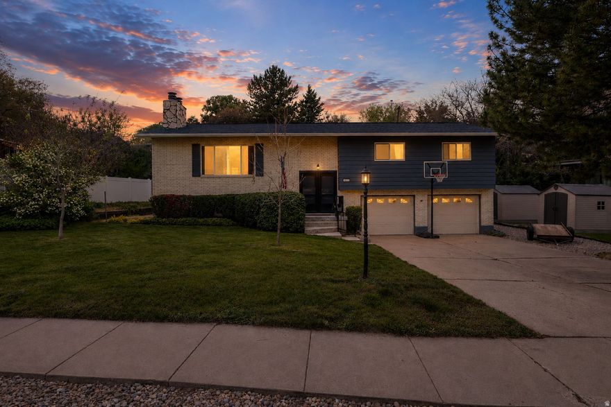 OPEN house 5/16/2026 2PM- 6PM Beautifully maintained South Ogden home located in the desirable Kiwana neighborhood with mature landscaping, incredible outdoor space, and charming character throughout. Situated on a spacious .29-acre lot, this property offers 5 bedrooms, 3 bathrooms, and a functional layout with multiple living and gathering spaces.  Inside, you'll find large windows providing natural light, updated finishes, unique Tiffany-style lighting accents, and a warm inviting feel throughout the home. The kitchen and dining areas flow nicely into the living spaces, creating an ideal setup for entertaining or everyday living.  The backyard is one of the standout features of the property with mature trees, a fully landscaped yard, outdoor gathering areas, storage sheds, and plenty of usable space to enjoy. The property offers a peaceful setting while still being conveniently located near shopping, dining, schools, parks, recreation, and commuter access.  Additional features include basement space with flexible use options, ample storage, established landscaping, and excellent curb appeal in an established South Ogden location.  Square footage figures are provided as a courtesy estimate only and were obtained from county records. Buyer is advised to obtain an independent measurement.