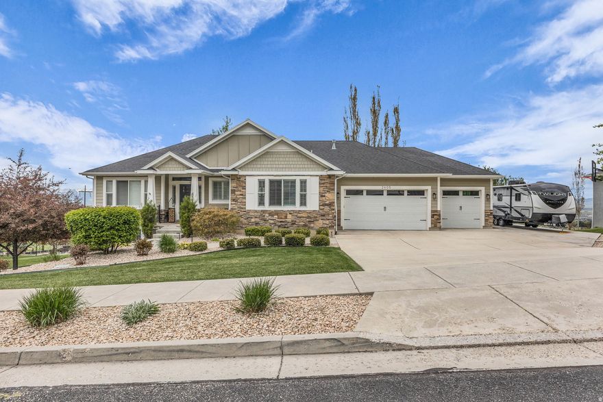 Nestled in a quiet North Logan neighborhood, this immaculate home offers stunning Cache Valley views on nearly half an acre. Enjoy an open floor plan filled with natural light, 4 spacious bedrooms, 3 baths, and a walkout basement plumbed for a second kitchen. The beautifully landscaped yard features fruit trees, garden space, covered porches, and an outdoor fire pit with no backyard neighbors. Access walking and riding trails directly from your yard. Includes an extended 3-car garage, RV parking, large storage room, and a delightful built-in playhouse. Move-in ready and exceptionally maintained!  Square footage figures are provided as a courtesy estimate only and were obtained from Buyer is advised to obtain an independent measurement.