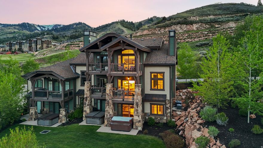 Experience elevated mountain living in this exceptional corner residence within the highly sought-after Fairway Springs community in Canyons Village. Ideally positioned alongside the Gene Bates-designed Canyons Golf Course, this beautifully appointed townhome captures sweeping golf course, ski mountain, and Uinta Mountain views while offering very close proximity and convenient access to the Frostwood Gondola and all the year-round amenities of Canyons Village. Offered fully furnished, the home features a thoughtfully designed open-concept layout with vaulted ceilings, oversized windows, and abundant natural light throughout. Slate, travertine, and hardwood flooring create a refined mountain-modern aesthetic, while the chef's kitchen is equipped with custom alder cabinetry, quartz countertops, and premium Wolf and Sub-Zero appliances. The spacious living and dining areas flow seamlessly for entertaining and relaxing alike, complemented by multiple outdoor spaces designed to take in the surrounding mountain setting. The private en-suite serves as a peaceful retreat, complete with its own balcony overlooking the surrounding mountains and golf course views. Enjoy a private hot tub, heated driveway, and attached garage for effortless year-round living. Whether skiing in the winter, golfing in the summer, or enjoying the endless hiking, biking, dining, and events throughout Park City, this residence embodies the very best of the Park City mountain lifestyle.