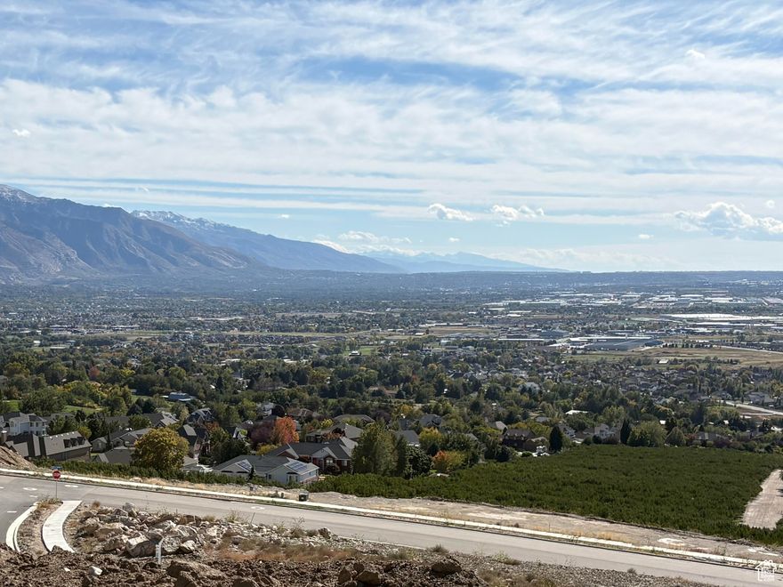 Nestled High on the Beautiful Pleasant View Bench, this stunning 0.40-Acre lot showcases sweeping Mountain and valley views along with breathtaking sunsets. The property offers the perfect setting for a custom home designed to highlight the area's natural beauty and serene surroundings. Enjoy the peaceful atmosphere while being just minutes away from hiking trails, skiing, parks, and local conveniences. this rare view lot provides an exceptional opportunity to build your dream home in one of Pleasant View's most desirable locations.