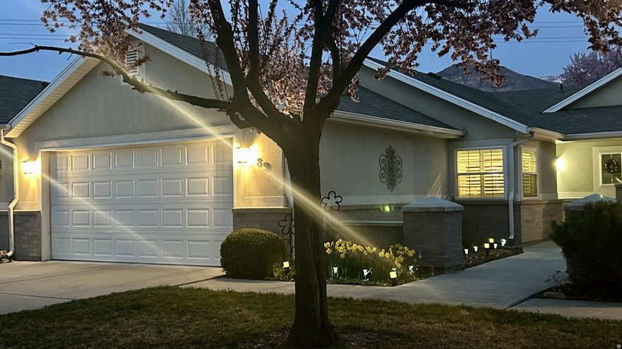 BEAUTIFUL and Comfortable, lowmaintenance single-level living in a friendly 55+ culdesac in southwest Provo. This movein ready 2 bed, 2 bath townhome (1,435 sq ft) is thoughtfully updated for easy, active adult living: stepfree singlelevel layout, new triplepane windows (2023) with wood shutters, crown molding, and durable updated flooring. The large kitchen-granite counters and upgraded stainless LG appliances-makes cooking and entertaining simple. The primary suite offers a fully updated bath with 39" dual-sink quartz vanity, spacious tiled shower with two shower heads, and a walk-in closet with custom shelving. A versatile bonus room works well for storage, hobbies, or a small home office. Practical updates include a new furnace (2026), new roof (2023), two-car garage with epoxy flooring, water conditioner and updated water heater, plus a covered patio with epoxy flooring. Convenient southwest Provo location near shopping and freeway access; HOA covers cable TV, high-speed internet, snow removal, watering, and yard maintenance. On-site RV parking available for a small additional fee.