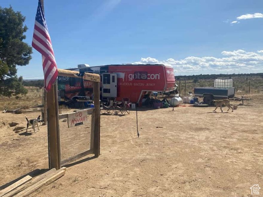 View the Lake!  View the mountains!  View the Big Sky!  This one can be used for recreation or year 'round living!  Just minutes from the Lake!  So close, that there is an abundance of wildlife!  5 acres to make your own place.  The fifth wheel is included.  The Seller will take $5,000 off the price of the property if you do not want the 5th wheel.  The property is partially fenced and is very private! Survey stakes are in!  Water is by 250 gallon cistern and the Watering Station is just off Hwy 40.  Solar and generator.  Power is available at buyer's expense.  Shed and chicken coop are included. Boat is included.  Propane and chemical toilet are leased. Current loan is assumable. Ask us for details.