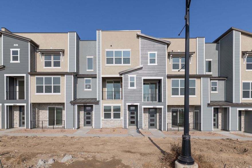 Welcome to Joshua Tree in Herriman, a vibrant townhome community where modern design meets effortless living. The Holland plan at Joshua Tree  a stylish 3-story townhome featuring 3 bedrooms, 3.5 baths, and 1,730 sq ft of thoughtfully designed living space. Enjoy modern finishes like granite countertops, stainless steel appliances, and 9' ceilings, plus a private deck. With energy-efficient features, a spacious primary suite, and landscaping maintained by the HOA, this home blends comfort, convenience, and low-maintenance living in the heart of Olympia.