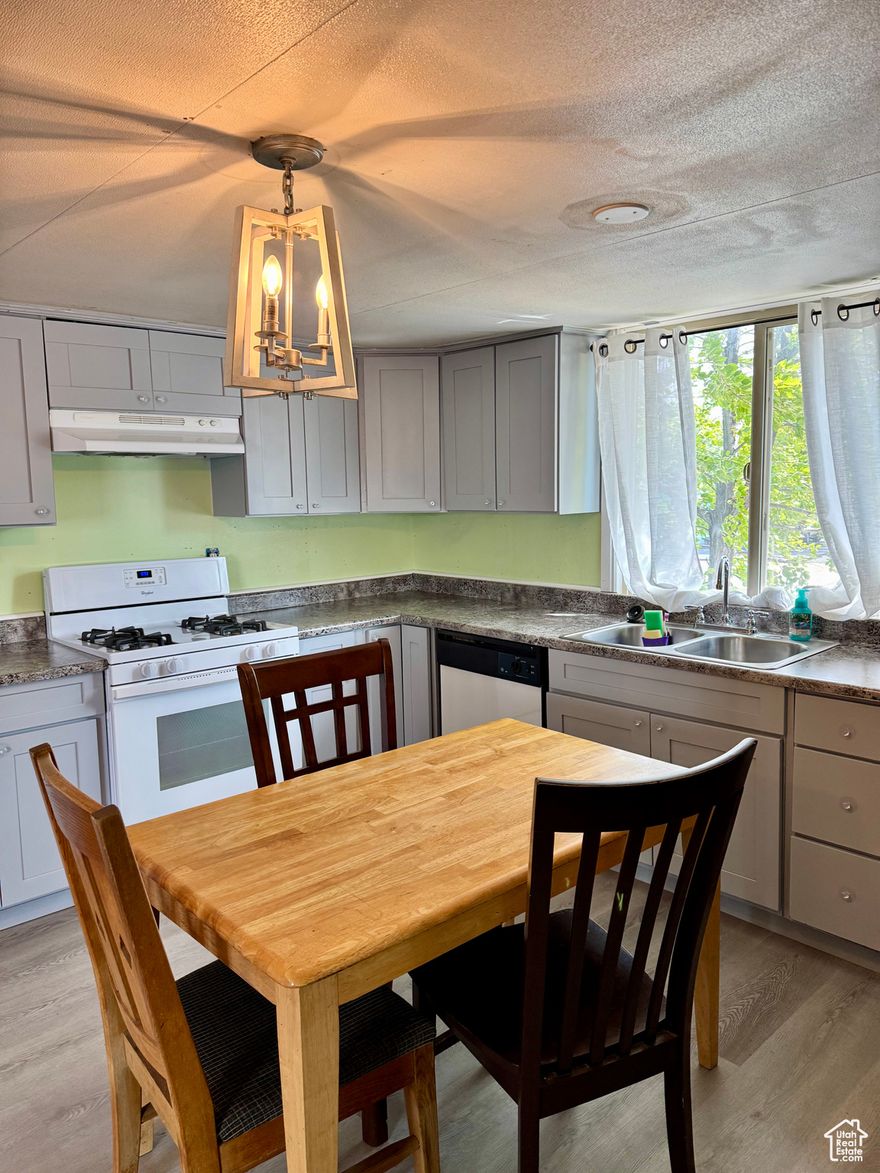 Affordable updated mobile home in the heart of West Valley! This charming home features a recently updated kitchen, a newly installed split A/C system, and a 2-car tandem carport. All appliances are included, making it truly move-in ready. Enjoy access to community amenities like a clubhouse, pool, and playground. Centrally located near schools, shopping, and major freeways. Seller financing available!  Square footage figures are provided as a courtesy estimate only and were obtained from public records . Buyer is advised to obtain an independent measurement.