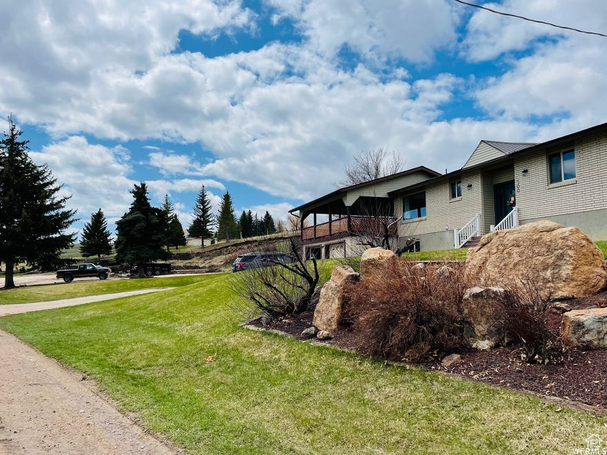 Beautiful home at the mouth of Sleights Canyon on 3 acres with 1.75 irrigation shares. No HOA could be used as a short term or long term rental or investment property. New heating and AC unit, new carpet, new doors, new driveway and rock wall, and a fun new accent wall in the basement. Direct access to National forest for summer and winter activities. The covered deck is good for year round use. This property has year round access and is approved for large animals.