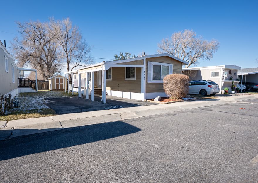 Welcome to this very nice and well-maintained 2-bedroom, 1-bath mobile home located in Sandy, Utah, just minutes from I-15 for easy commuting and access to shopping, dining, and entertainment. This home features a warm and inviting living area with abundant natural light, and beautiful wood-style flooring throughout. The open layout creates a comfortable space for relaxing or entertaining. The kitchen offers ample cabinet space, stylish countertops, and a dedicated dining area, making everyday living convenient and functional. Large windows throughout the home bring in plenty of sunlight, creating a bright and cheerful atmosphere. With its convenient location, cozy interior, and thoughtful layout, this home is a great opportunity for affordable living in a desirable Sandy neighborhood.