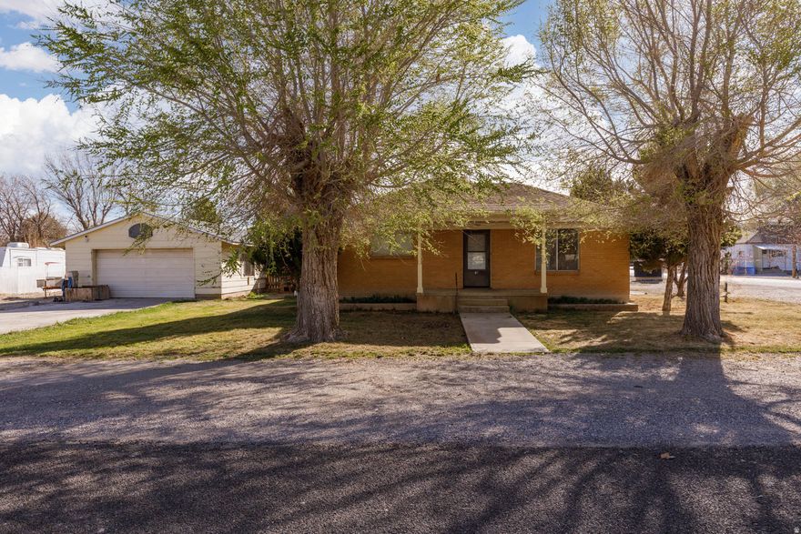 Charming Corner Brick Home with Detached 2-Car Garage and Prime Parking Nestled on a corner lot, this 3-bedroom, 1.5-bath brick home combines timeless appeal with practical living space and thoughtful storage. Inside, you'll find large living and dining rooms that are perfect for daily family life and entertaining guests. Highlights: - 3 bedrooms, 1.5 baths - Large living and dining rooms for easy living and gatherings - Extra storage space throughout - Room for a garden, plus mature fruit trees adding charm and shade - Large detached 2-car garage with ample parking for trailers or RVs - Plenty of space for guest parking This home offers solid brick construction, abundant storage, and a welcoming layout that accommodates both everyday living and special occasions. The detached garage and generous parking capabilities provide turnkey convenience for hobbies, vehicles, or future projects.   Ready to make it yours? Schedule a showing today and envision the lifestyle this corner beauty can offer. Contact Tasia Duncan to book your tour.
