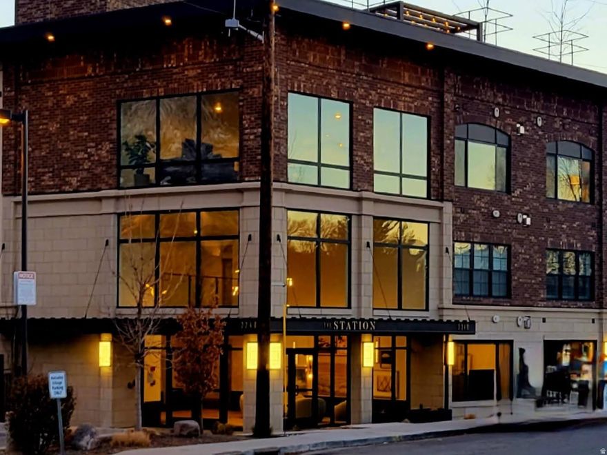 Welcome to The Station at Holladay Village-an exclusive collection of thoughtfully designed residences in one of Salt Lake's most desirable and walkable communities. This private enclave offers secure, low-maintenance living with the convenience of single-level floor plans and upscale amenities throughout. This spacious 3-bedroom, 3-bathroom condo features an open-concept layout filled with natural light and enhanced by high-end finishes. Designed for comfort and functionality, the home includes two en-suite bedrooms, ideal for guests or multi-generational living. Residents also enjoy access to an exclusive rooftop patio featuring an oversized fire pit and BBQ area-perfect for entertaining or taking in breathtaking views of Mt. Olympus and the entire Salt Lake Valley. Additional highlights include climate-controlled parking, dedicated storage, a stylish club room on the third floor, and convenient elevator access. Enjoy a short walk to Holladay City Park, including pickleball courts, as well as Holladay Village where a variety of amenities are right at your fingertips-dining, shopping, grocery stores, food trucks, coffee shops, bakeries, the post office, and entertainment. Square footage figures are provided as a courtesy estimate only and were obtained from tax records.