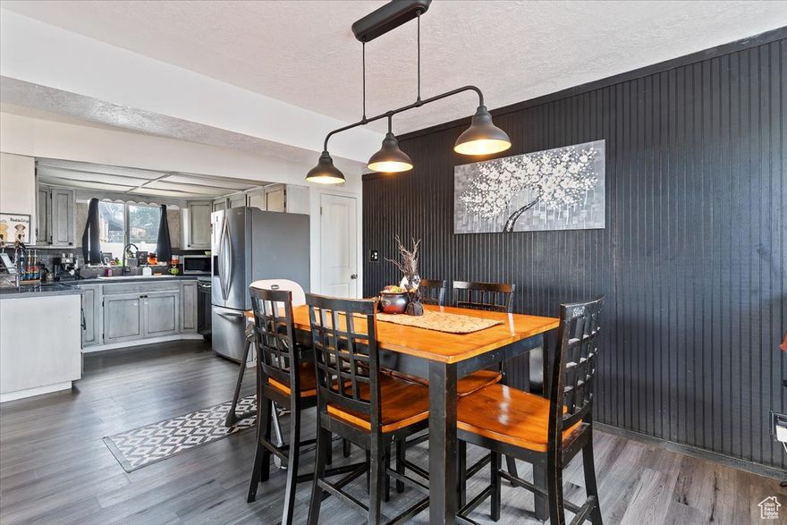 Welcome to this beautifully updated home that blends comfort, charm, and convenience. Inside, you'll find spacious family rooms and huge windows that fill the home with natural light. The new carpet and fresh paint (2023) add a modern touch, while the layout offers plenty of room to gather and relax. The extra-large laundry room with built-in sink makes everyday living a breeze, adding both function and style. Outside, enjoy an open backyard with space to play or entertain, plus unique touches like a blueberry bush in the front and a grapevine in the back. Located just minutes from Riverdale Road, 25th Street in Ogden, the Beverly Terrace Palace Playhouse, and close to the golf course, this home is surrounded by dining, entertainment, and recreation. Don't miss your chance to own this inviting property that combines thoughtful updates, natural light, and an unbeatable location!