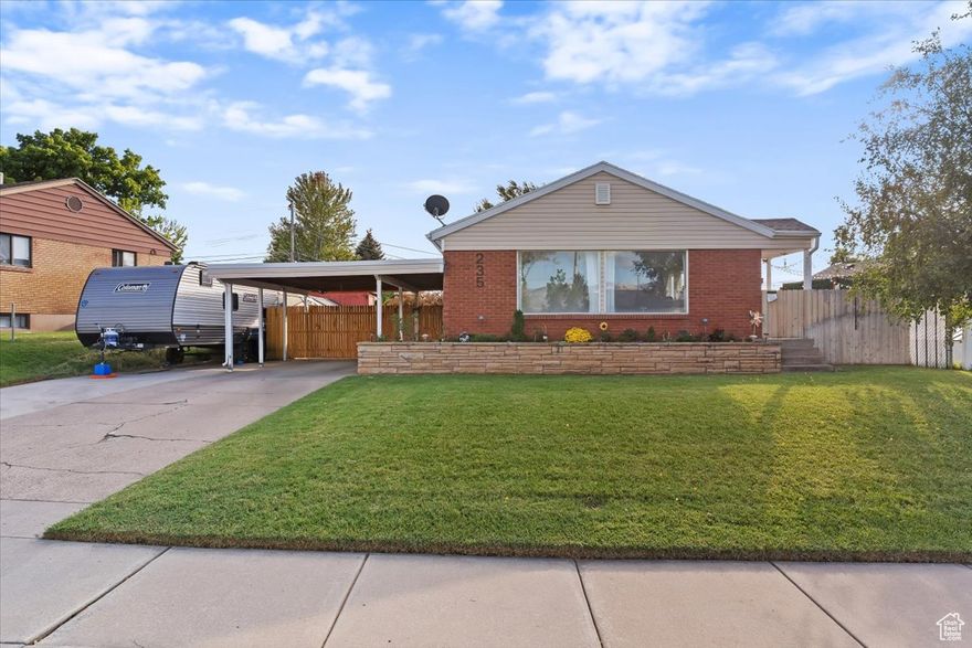 Welcome to this beautifully updated home that blends comfort, charm, and convenience. Inside, you'll find spacious family rooms and huge windows that fill the home with natural light. The new carpet and fresh paint (2023) add a modern touch, while the layout offers plenty of room to gather and relax. The extra-large laundry room with built-in sink makes everyday living a breeze, adding both function and style. Outside, enjoy an open backyard with space to play or entertain, plus unique touches like a blueberry bush in the front and a grapevine in the back. Located just minutes from Riverdale Road, 25th Street in Ogden, the Beverly Terrace Palace Playhouse, and close to the golf course, this home is surrounded by dining, entertainment, and recreation. Don't miss your chance to own this inviting property that combines thoughtful updates, natural light, and an unbeatable location!