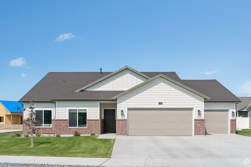 Why wait for new construction? This home is move-in ready and has barely been lived in! Completed in late 2024, this luxury single-level, no-step entry rambler offers over $60k in upgrades and thoughtful design throughout. Enjoy 9' ceilings that create a sense of openness in the spacious great room and kitchen/dining area. The upgraded countertops, full-height glass cabinets, designer oven hood, and large butler's pantry make this a true chef's kitchen. Expansive windows and added dining windows fill the home with natural light, while the 12' sliding glass doors provide seamless indoor/outdoor living. The primary suite features shiplap accents and an upgraded bath, while custom fireplace finishes and upgraded ceiling fans add style and comfort. With 2 bedrooms plus a den/office (easily converted to a 3rd bedroom), this home offers flexible living options. The extra-deep 3-car garage provides plenty of space for vehicles, storage, or a workshop. Located in the Cottages at Harvest Fields 55+ community, you'll love the maintenance-free lifestyle with HOA-covered yard care, snow removal, and pickleball courts. This home offers the feel of brand new without the wait!